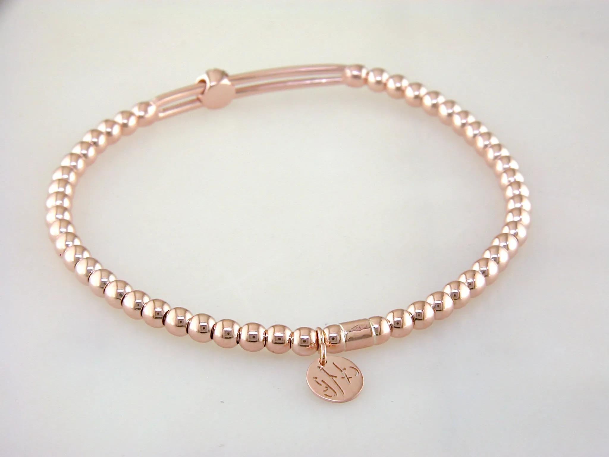 Hulchi Belluni Fidget Bracelet with Single Pave Diamond Moveable Station Rose Gold Stretch Stackable